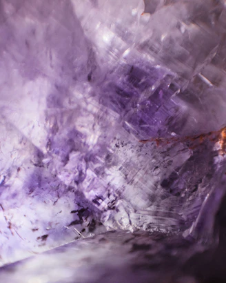 a close up of a purple and white rock