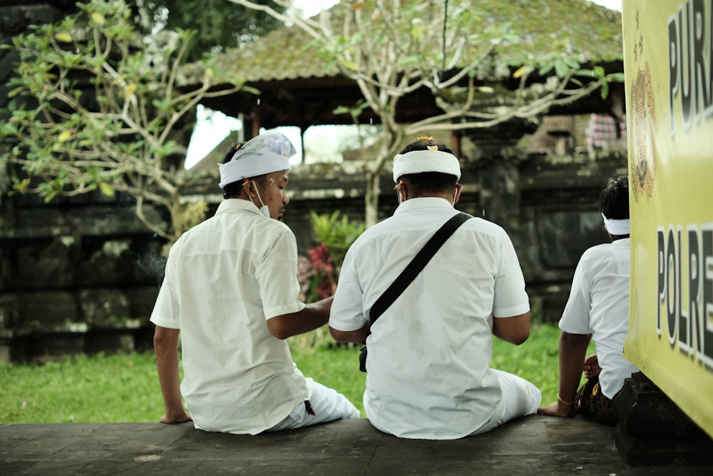 a group of men sitting next to each other