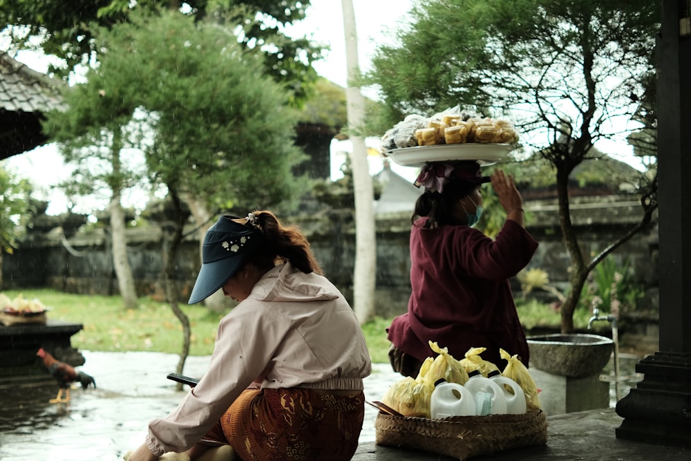 a couple of women sitting next to each other