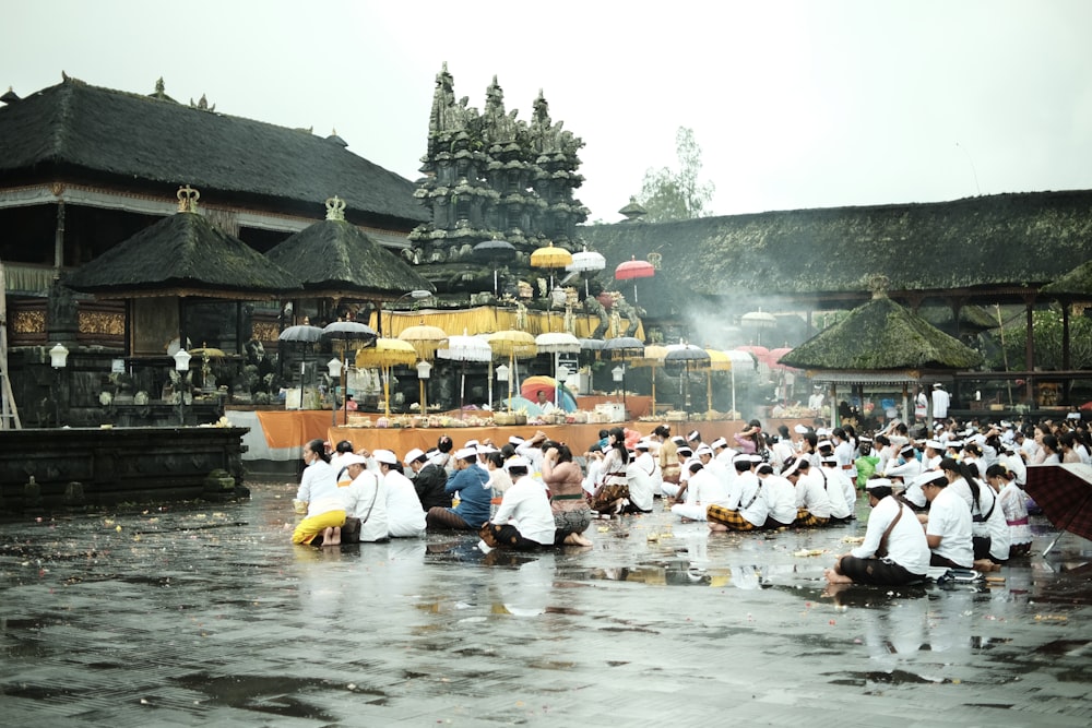 a large group of people in white outfits