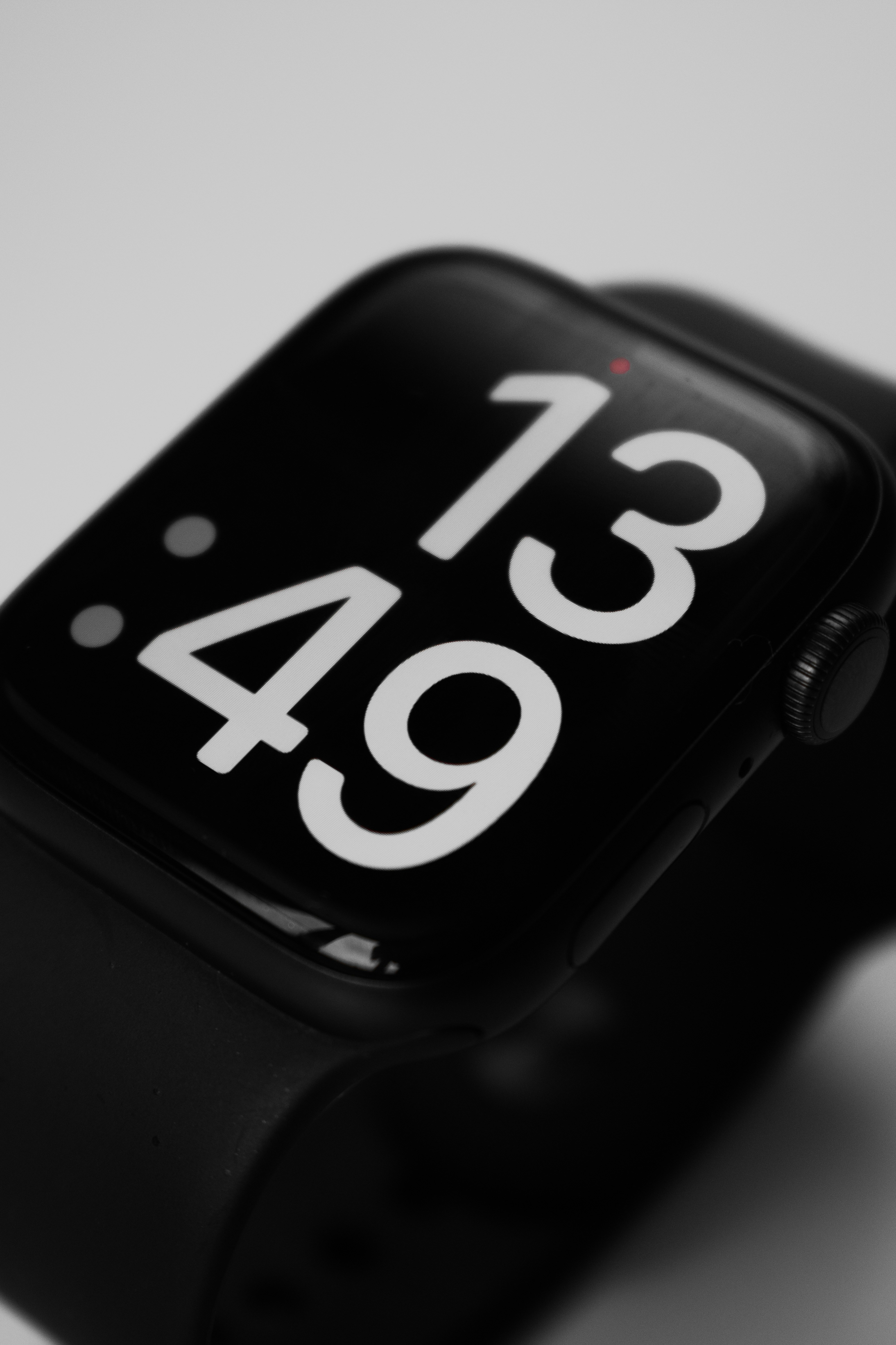 a black apple watch with the time displayed