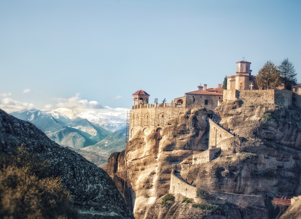 a castle perched on top of a rocky cliff