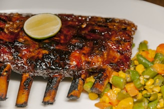 a plate of food with a fork and a piece of meat