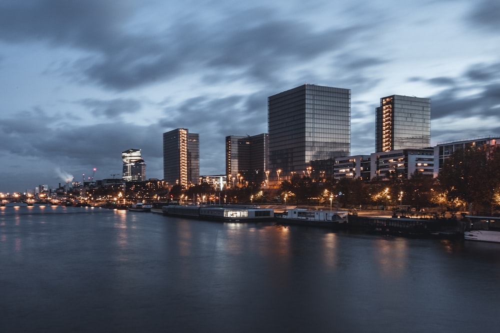 a body of water with a city in the background