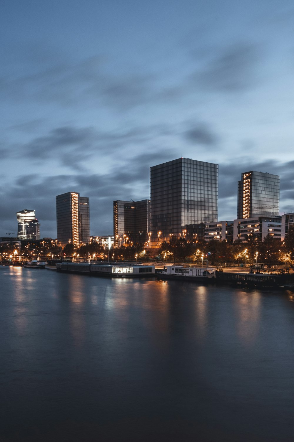 a body of water with a city in the background