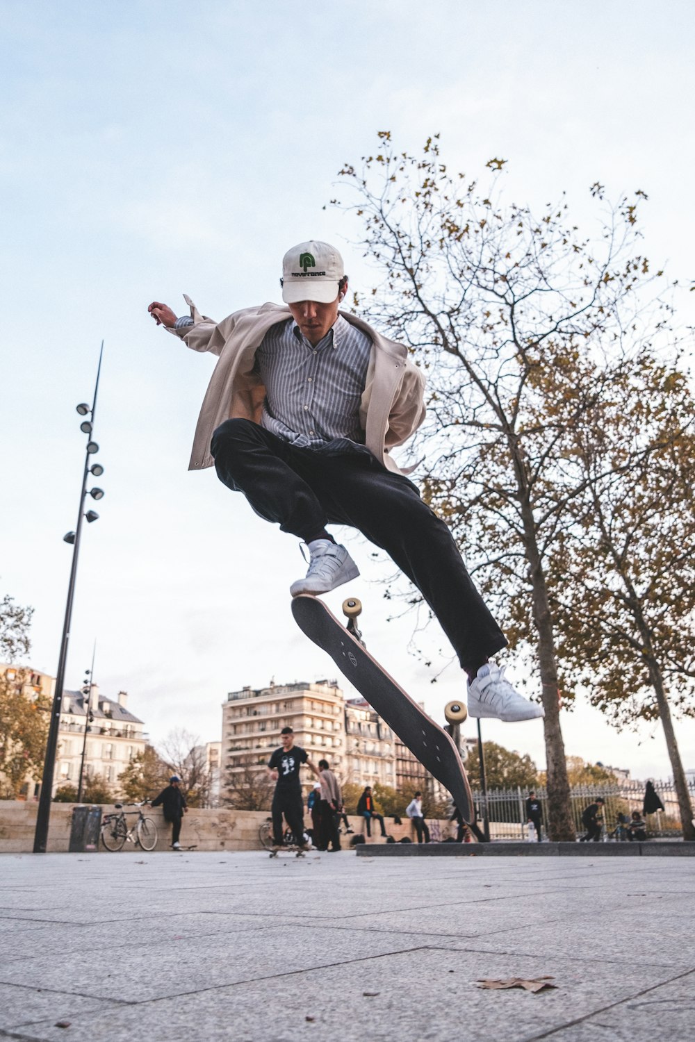 a man flying through the air while riding a skateboard