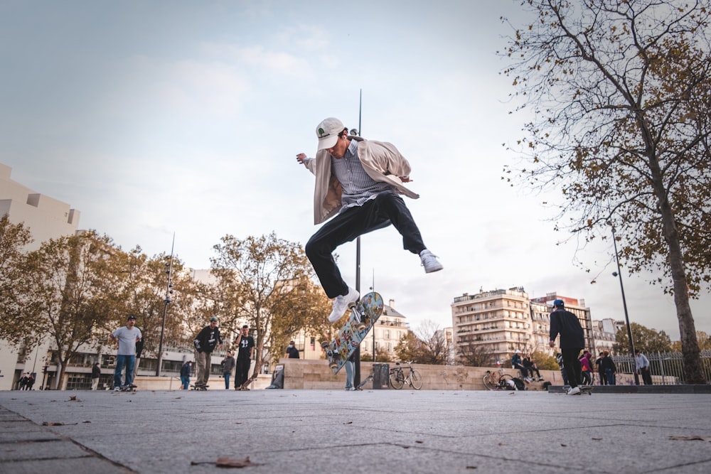 a man doing a trick on a skateboard in the air