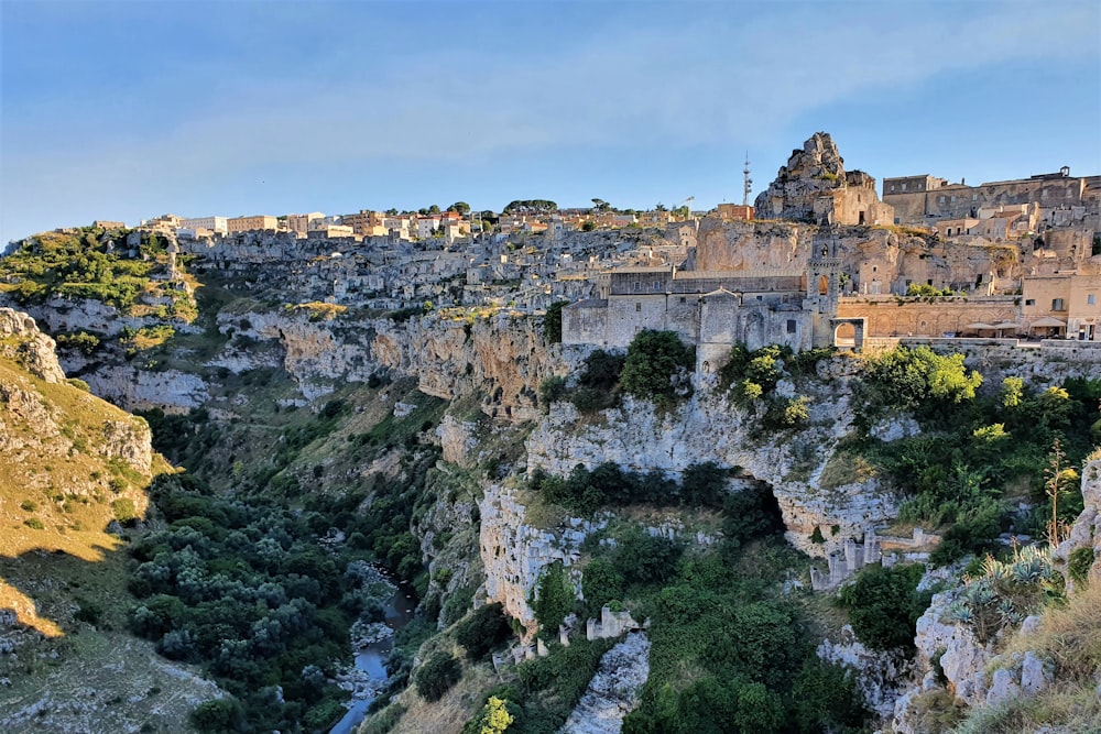 a view of a village on top of a cliff