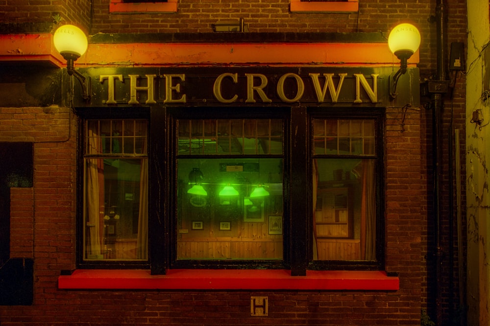 a brick building with a sign that says the crown