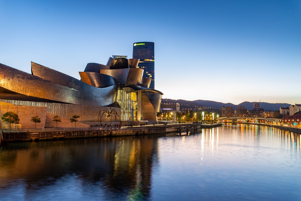 a large building next to a body of water