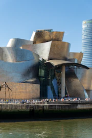 a large building with a lot of people walking around it