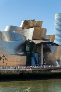 a large building with a lot of people walking around it