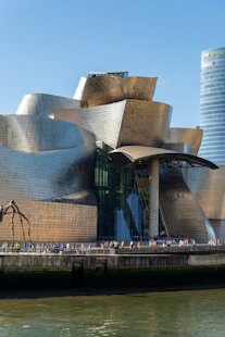 a large building with a lot of people walking around it