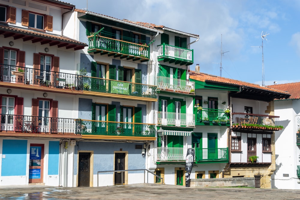 a row of multi - story buildings with balconies and balconies on