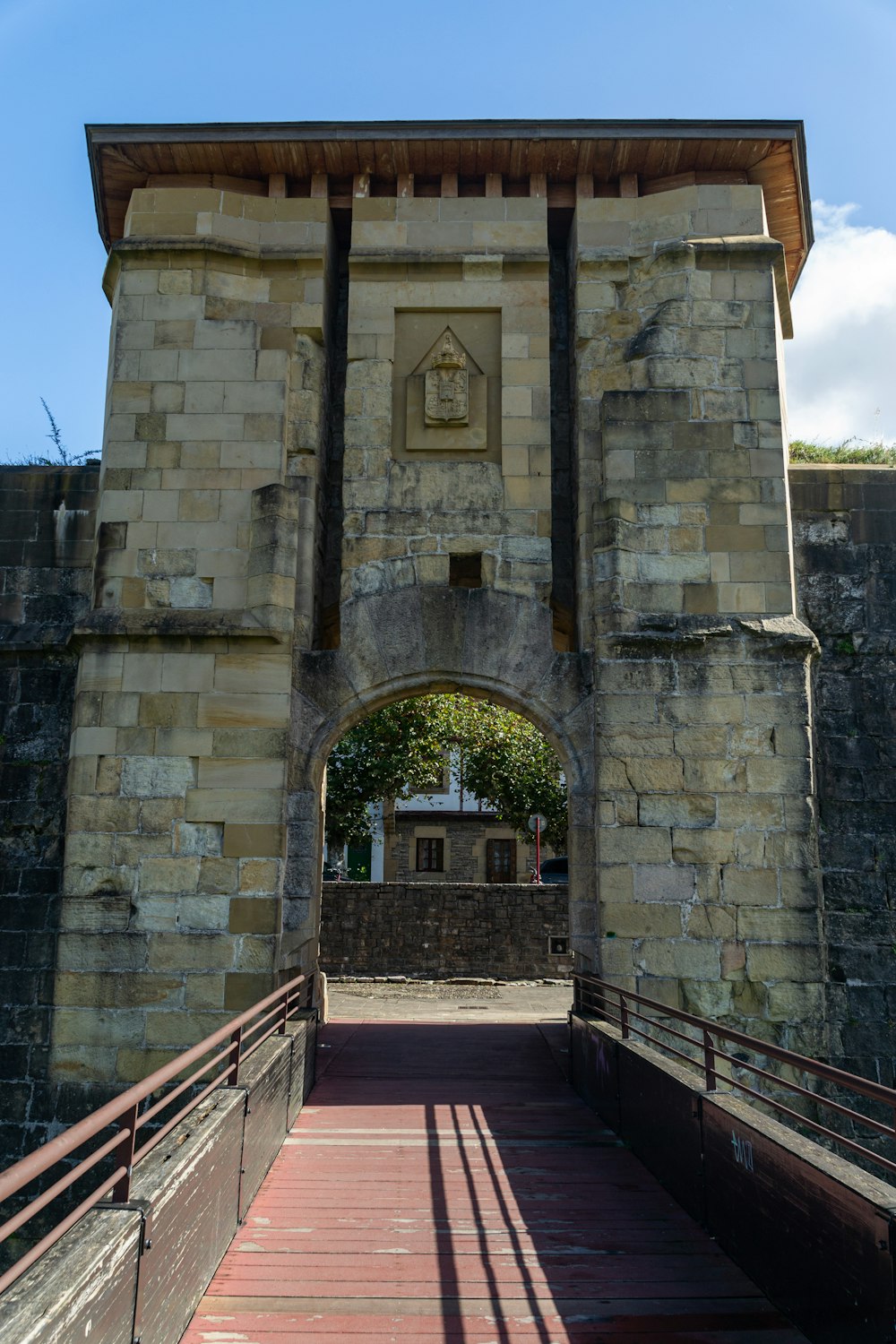 a large stone building with a clock on it's side