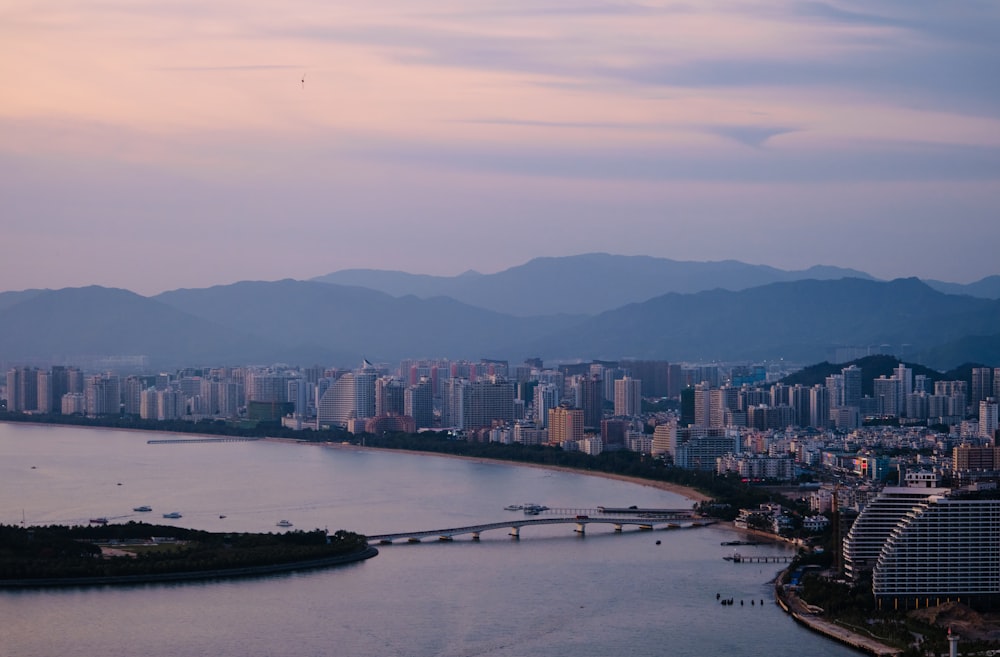 a large body of water with a city in the background