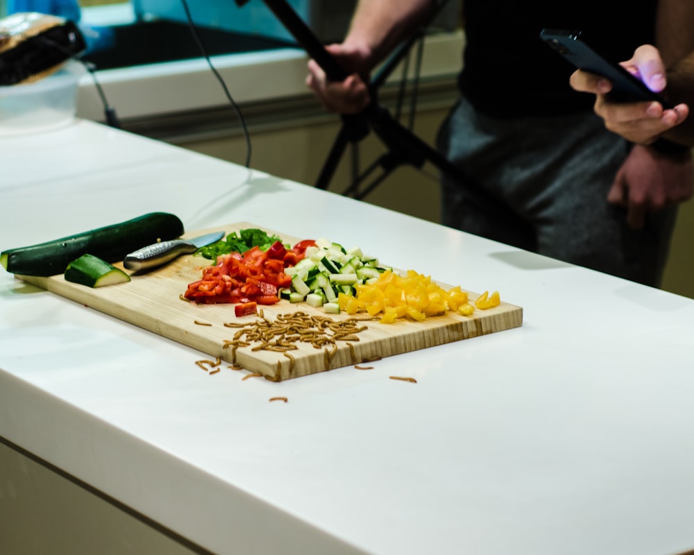 a cutting board with chopped vegetables on it