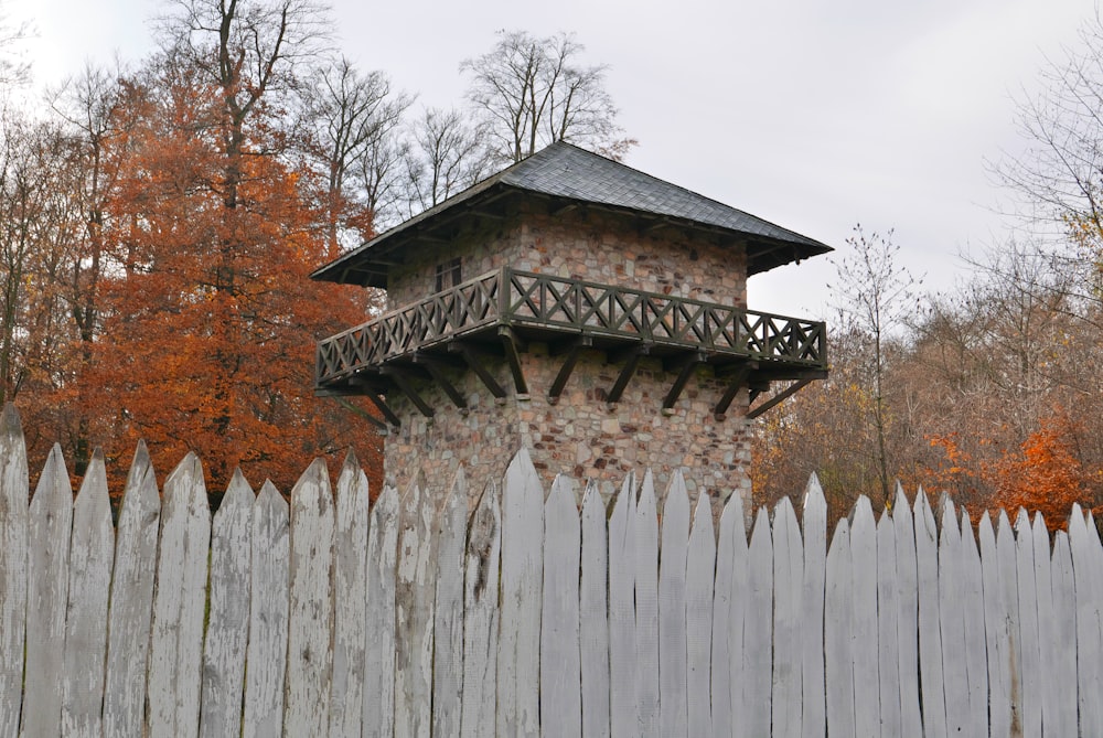 a wooden fence with a tower on top of it