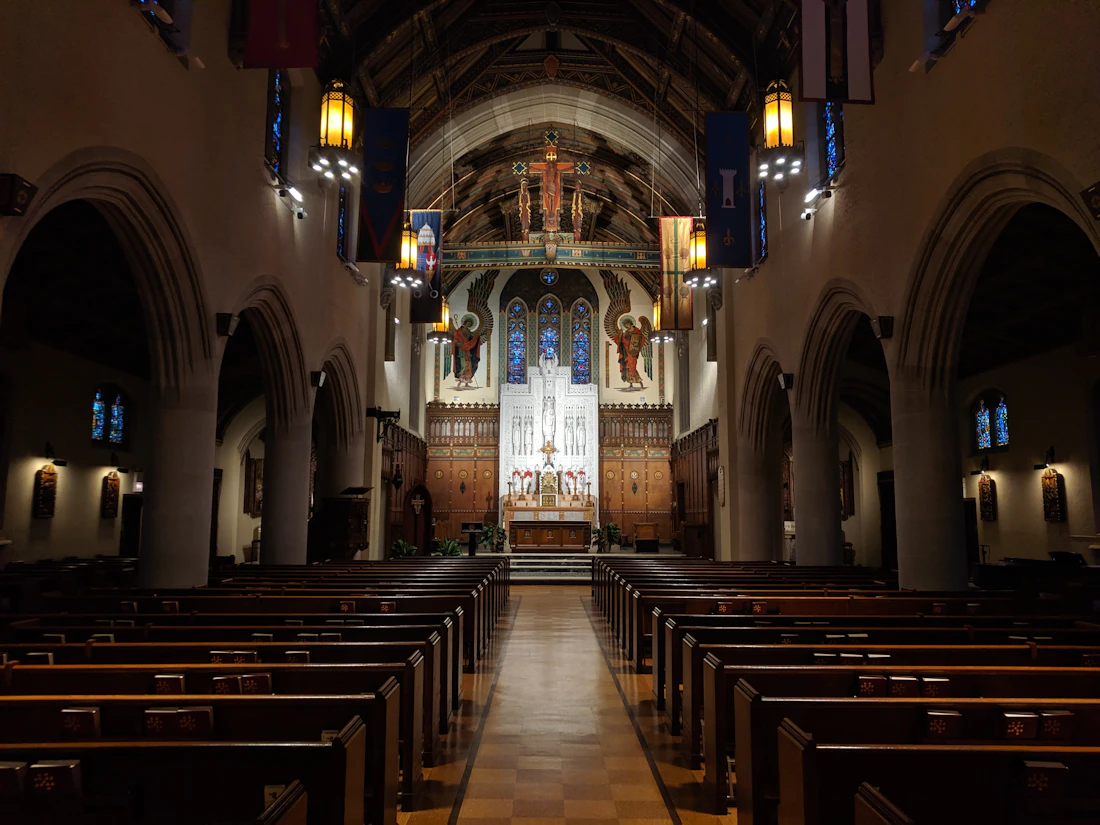 Interior of a Catholic church with pews leading to the altar