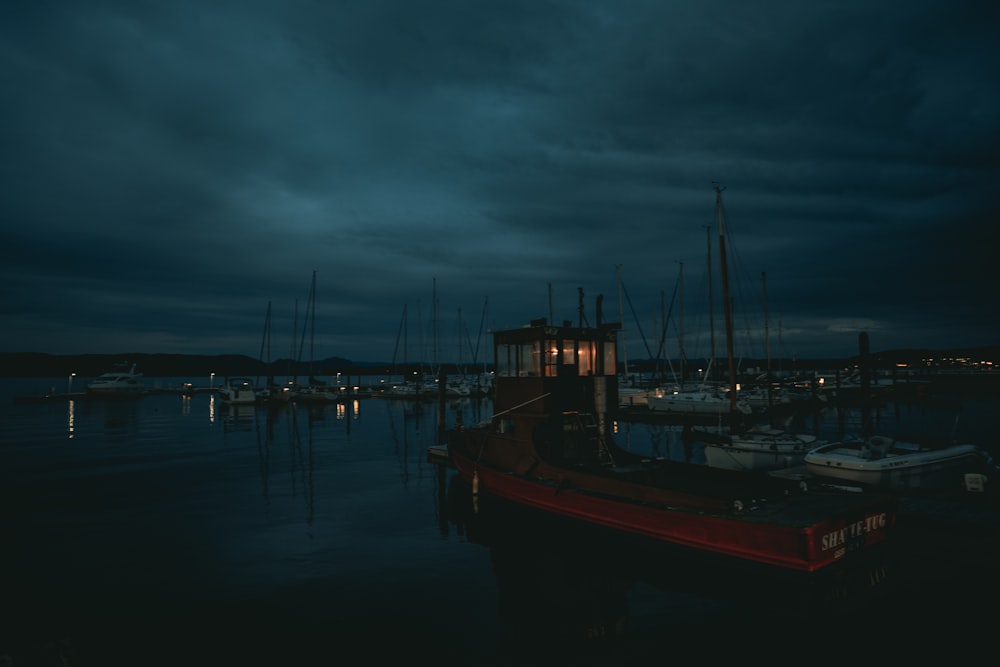 a group of boats floating on top of a body of water