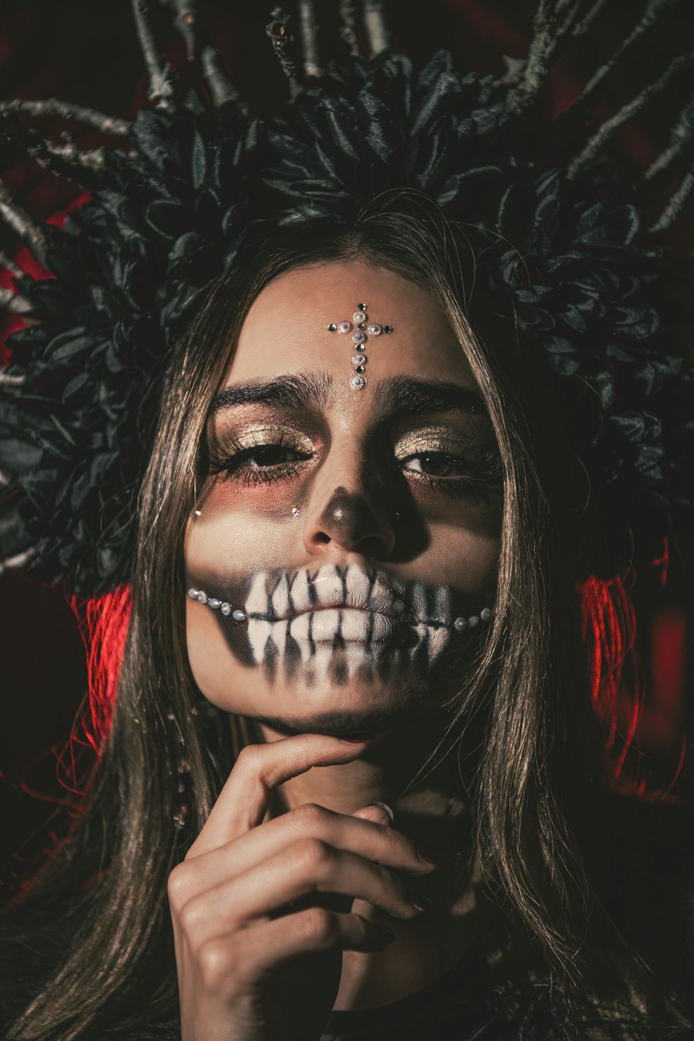 a woman with makeup painted to look like a skeleton