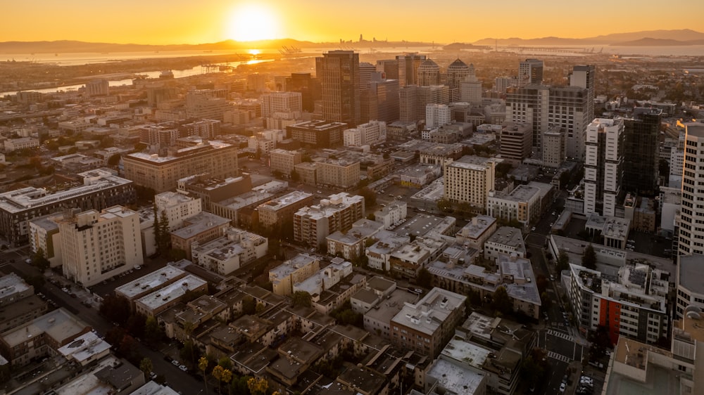 the sun is setting over the city of san francisco