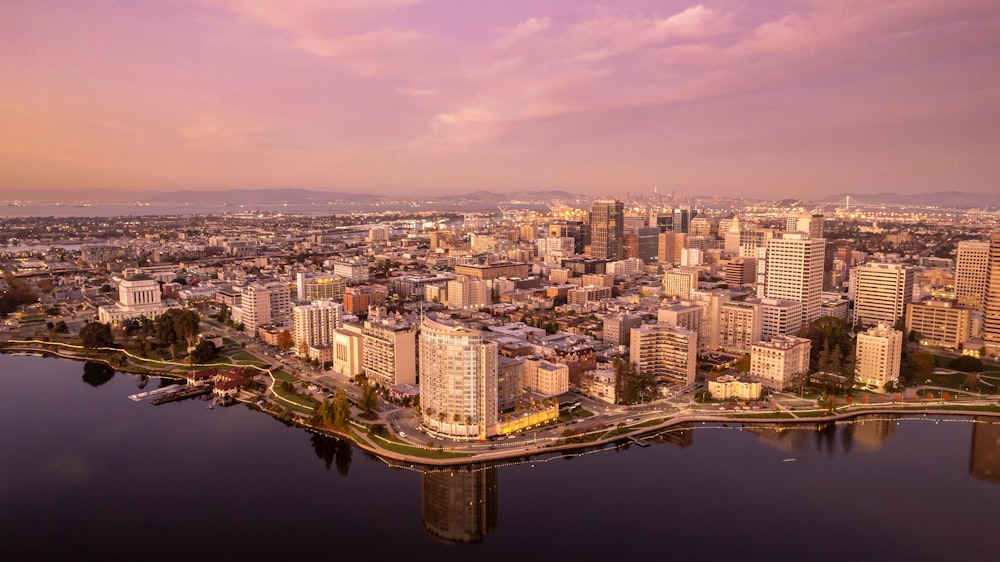 an aerial view of a city with a bridge over a body of water