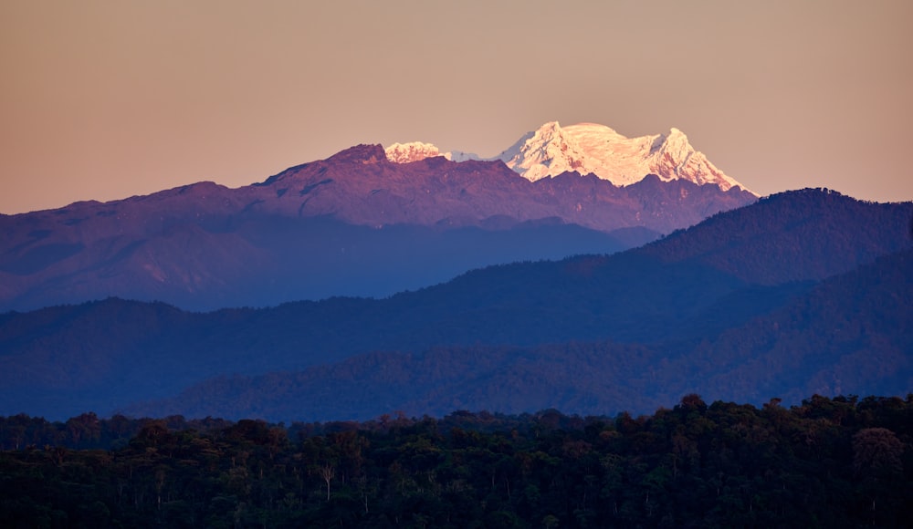 a view of a mountain range at sunset