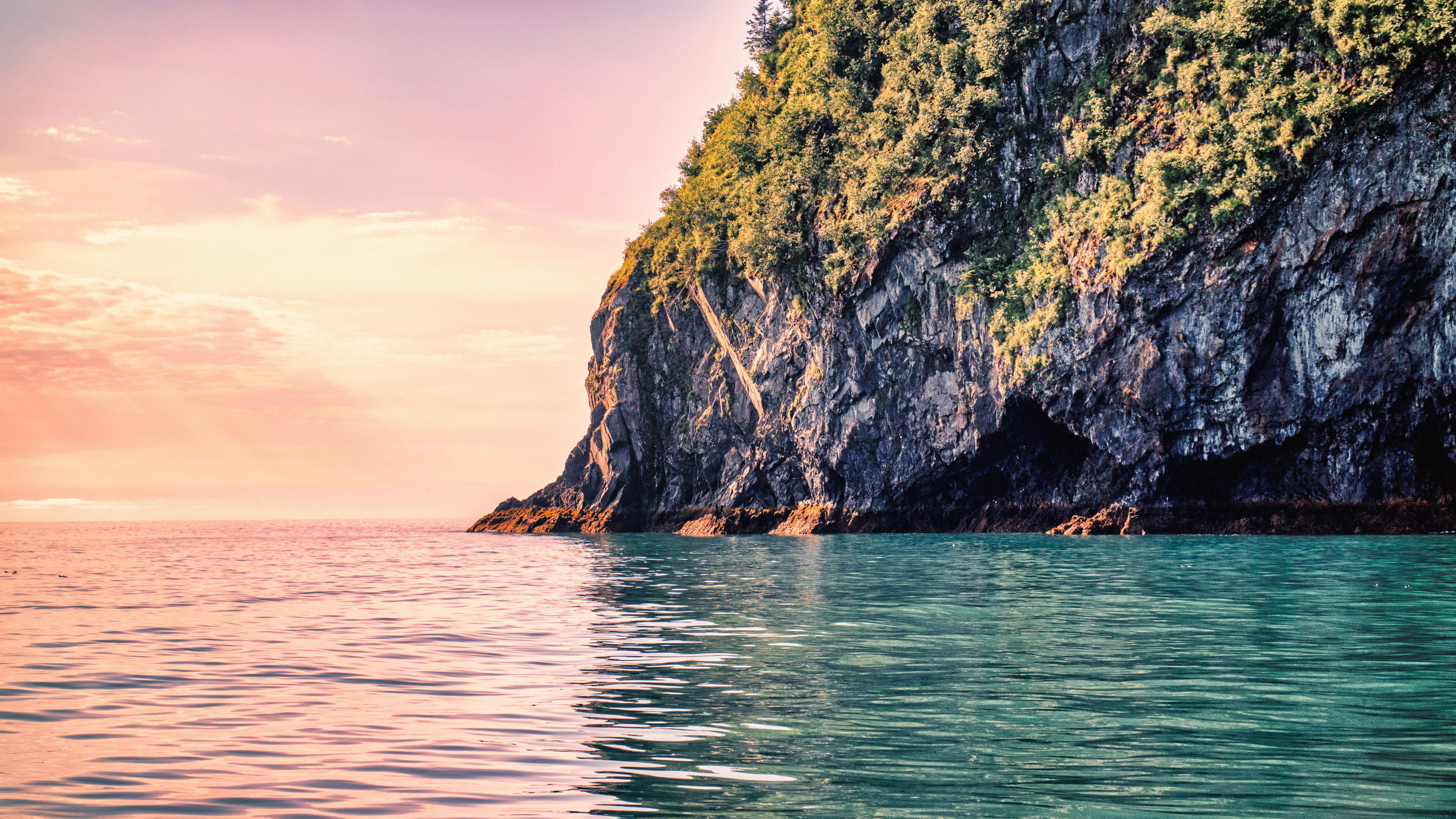 a rock outcropping in the middle of a body of water, Kenai Fjords 