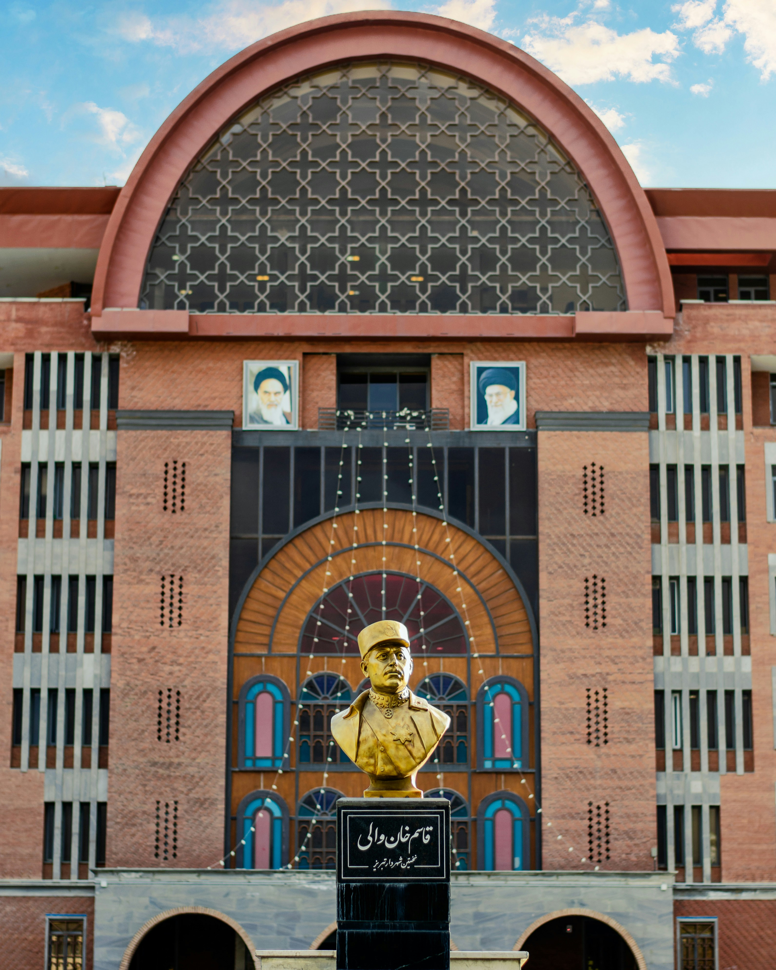 a statue of a man in front of a building