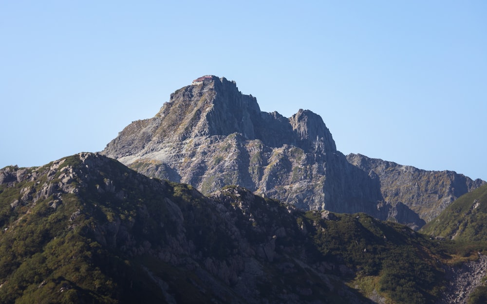 a very tall mountain with a sky background