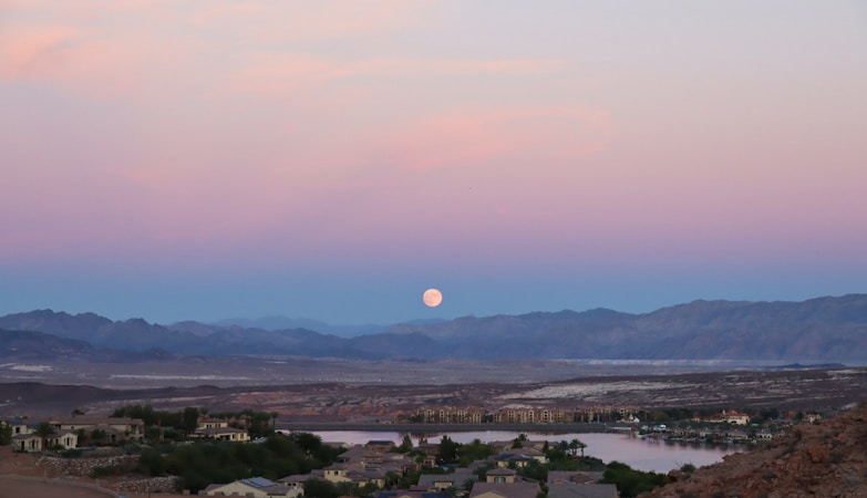 A Henderson-area desert neighborhood at dusk with mountains in the background, near where the West Henderson rezoning is proposed