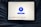 A tablet displaying a VPN application interface with a white background. The screen shows a large blue button labeled 'Disconnect' in the center, surrounded by circular lines. Below, there are several country flag icons representing different server locations, including Netherlands, Germany, Canada, Singapore, India, New York, and San Francisco. The tablet is resting on a person's lap, wearing blue jeans.