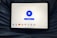 A tablet displaying a VPN application interface with a white background. The screen shows a large blue button labeled 'Disconnect' in the center, surrounded by circular lines. Below, there are several country flag icons representing different server locations, including Netherlands, Germany, Canada, Singapore, India, New York, and San Francisco. The tablet is resting on a person's lap, wearing blue jeans.