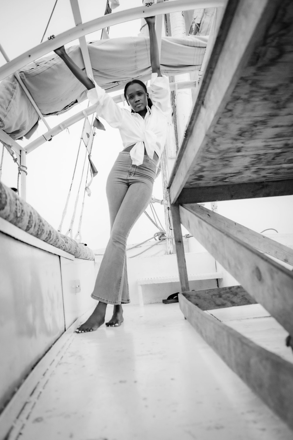 a woman standing on the deck of a boat