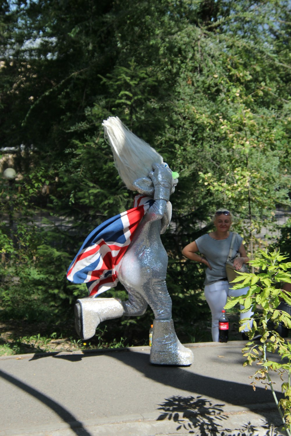 a statue of a man in a suit carrying a flag