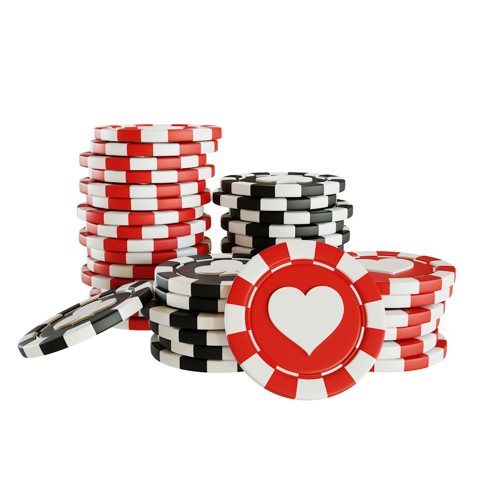 a stack of poker chips with a heart on top