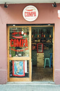 a store front with a sign that says compa
