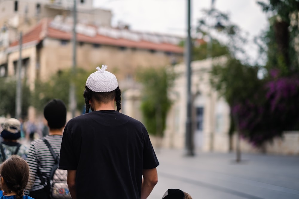 a group of people walking down a street