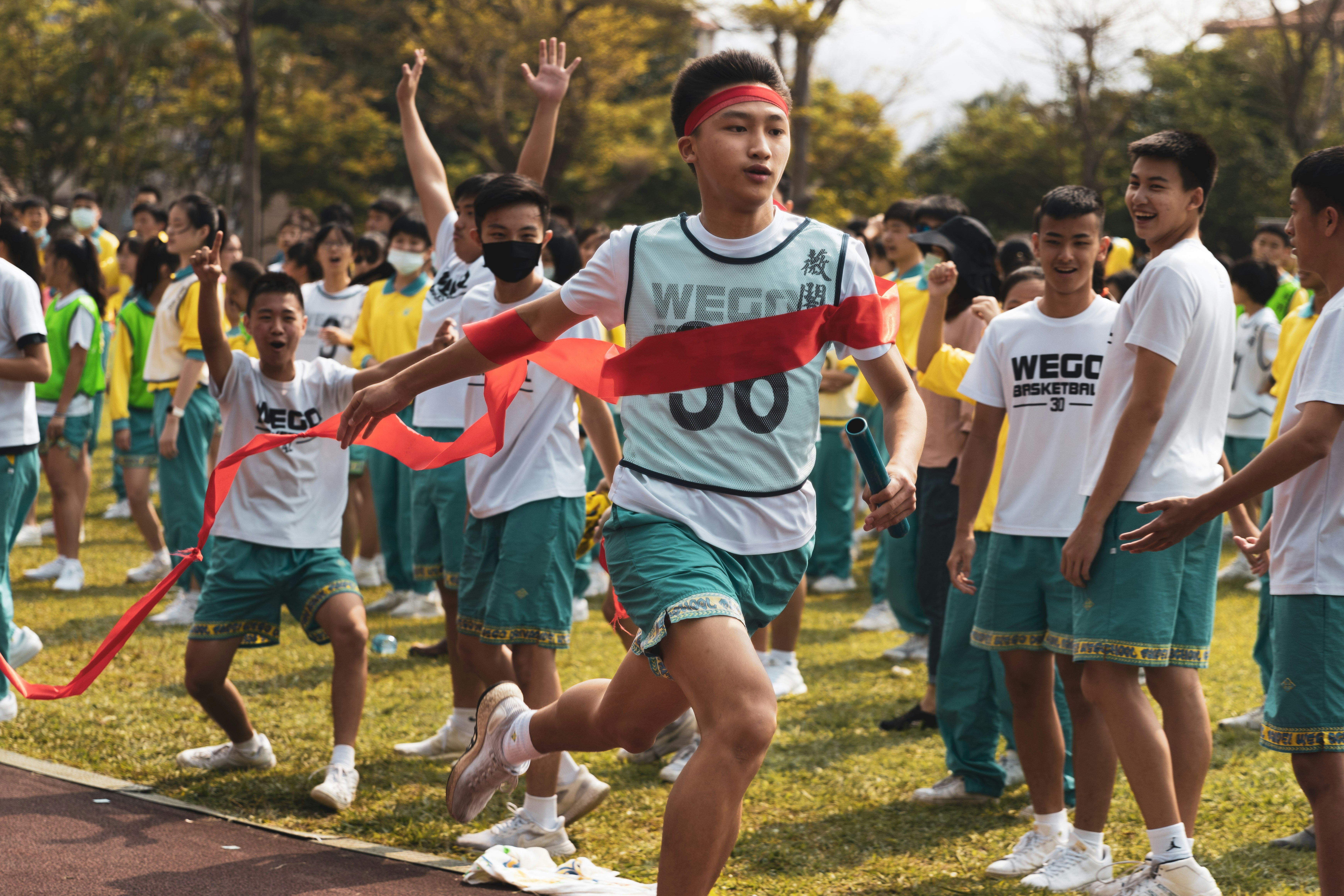 a group of young men running across a field