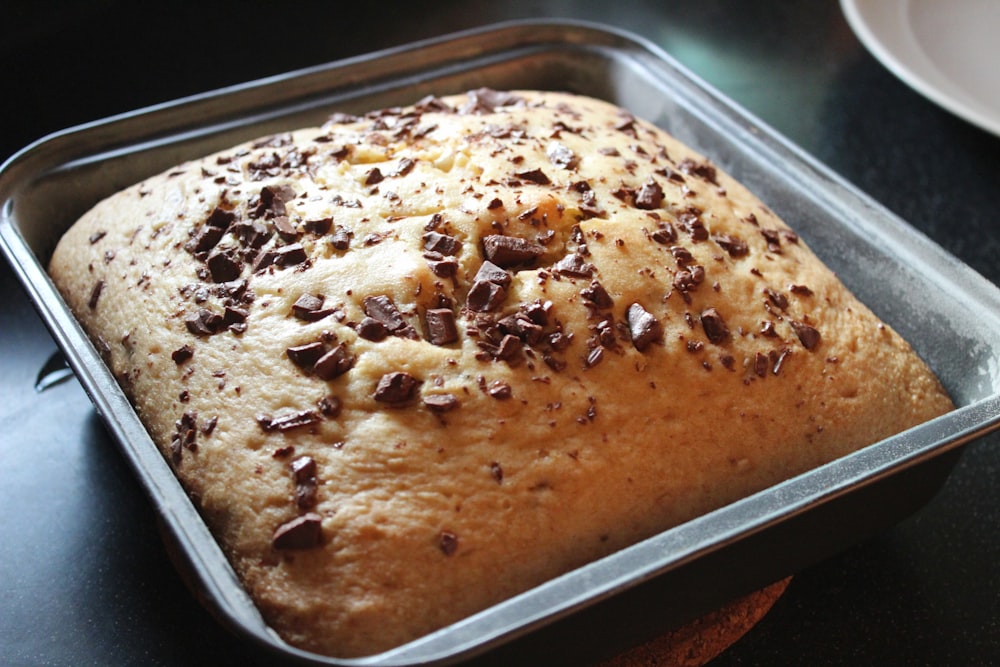 a loaf of bread in a pan on a table