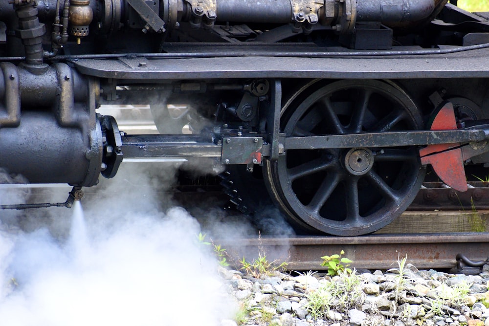 a close up of a steam engine on a train