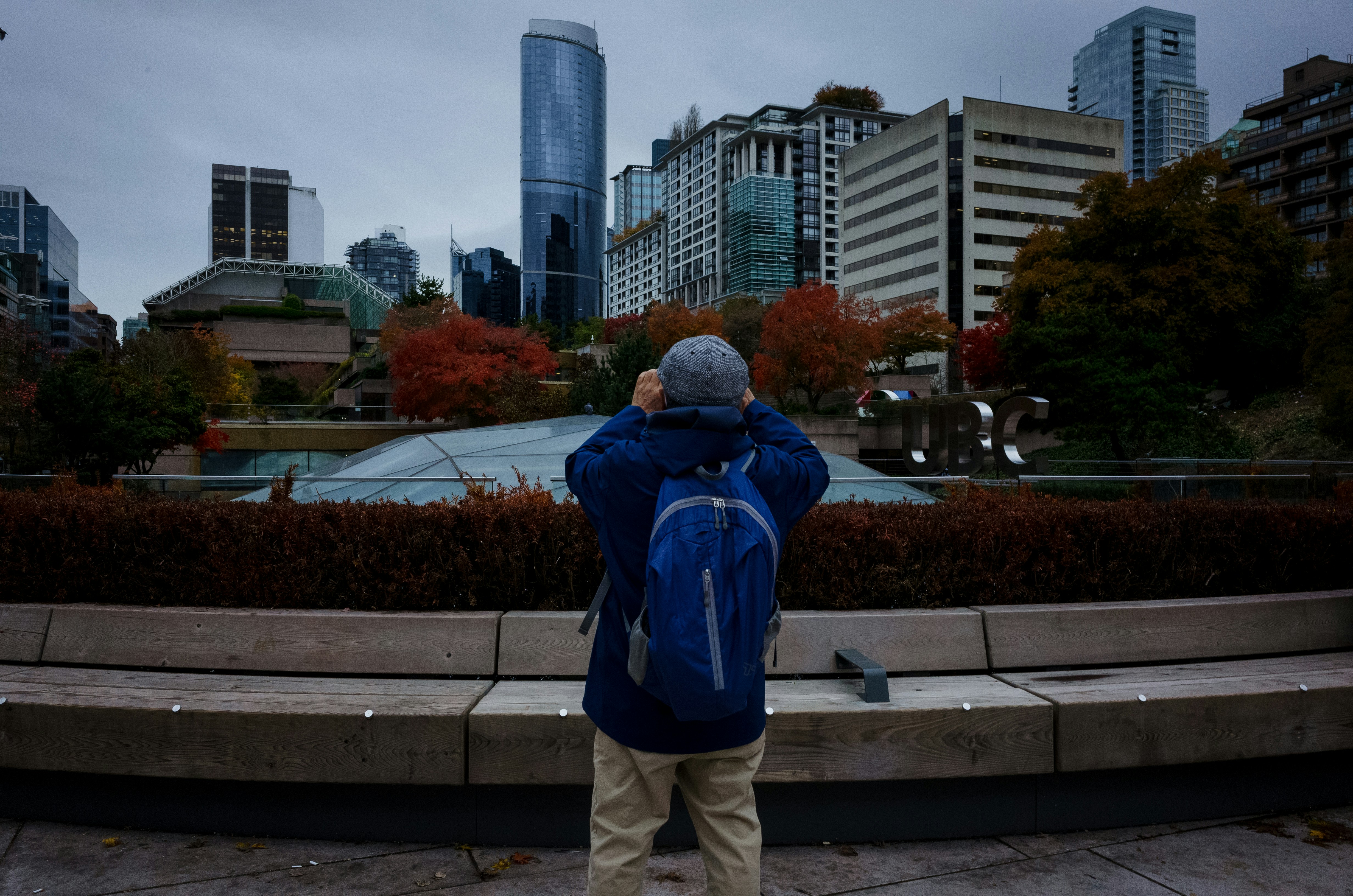 a person taking a picture of a city skyline
