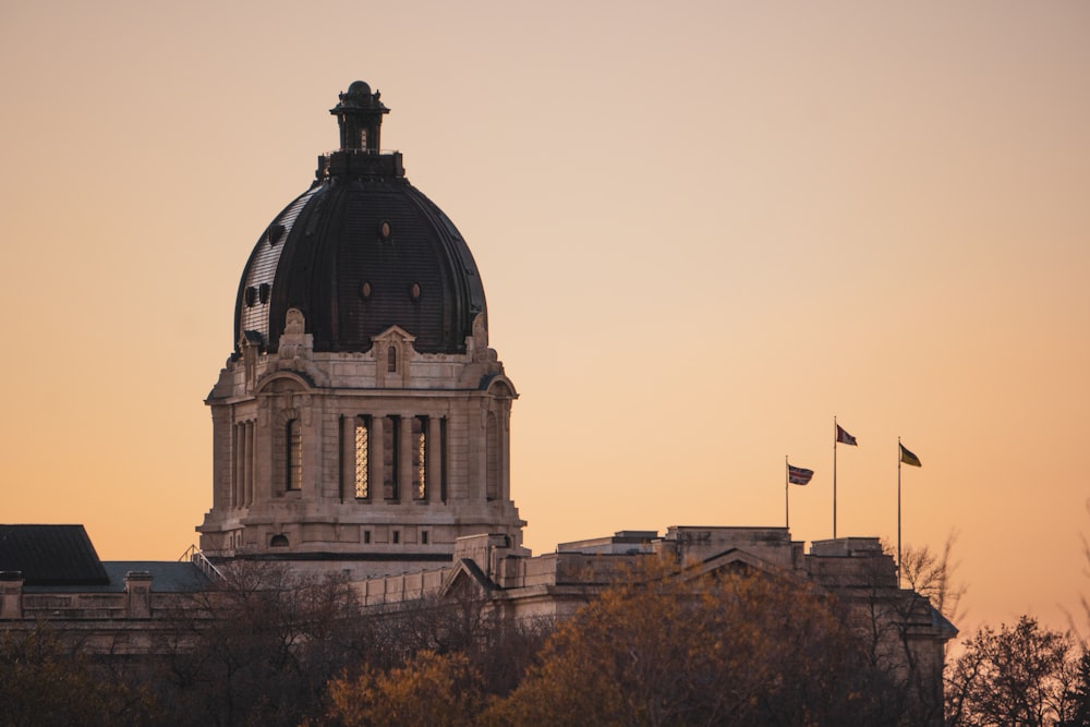 a building with a dome and a flag on top