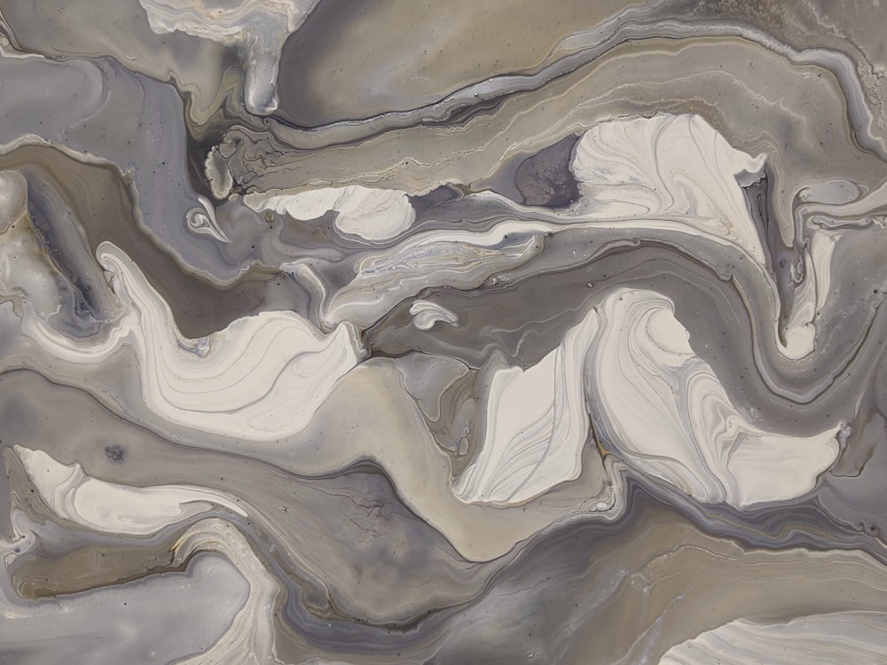 an abstract painting of grey and white colors