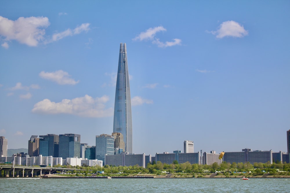 a very tall building towering over a city