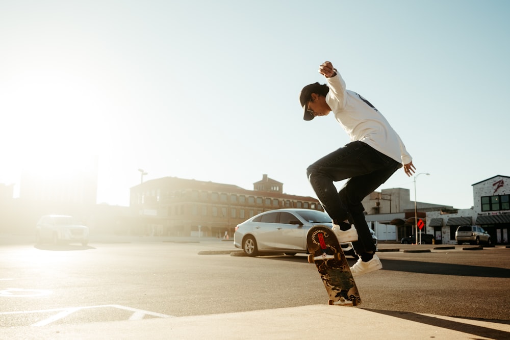 a man riding a skateboard down the side of a road