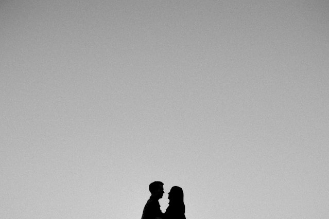 a man and a woman standing next to each other