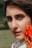 a close up of a person holding a flower