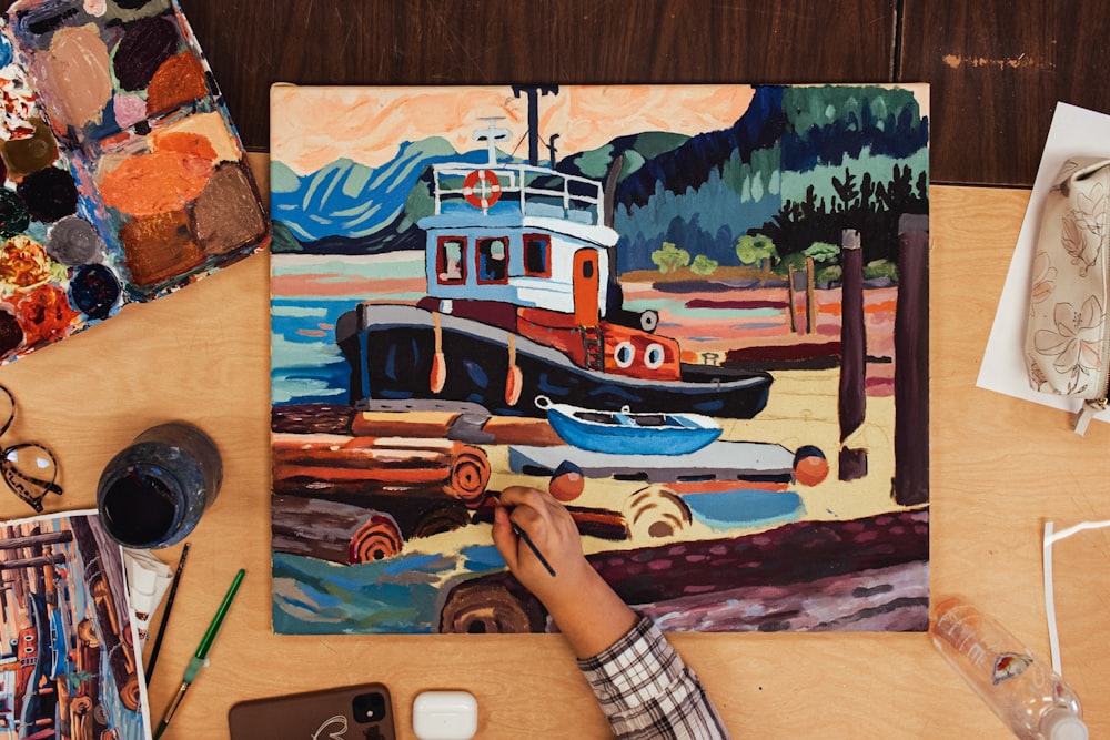 a person is painting a picture of a boat
